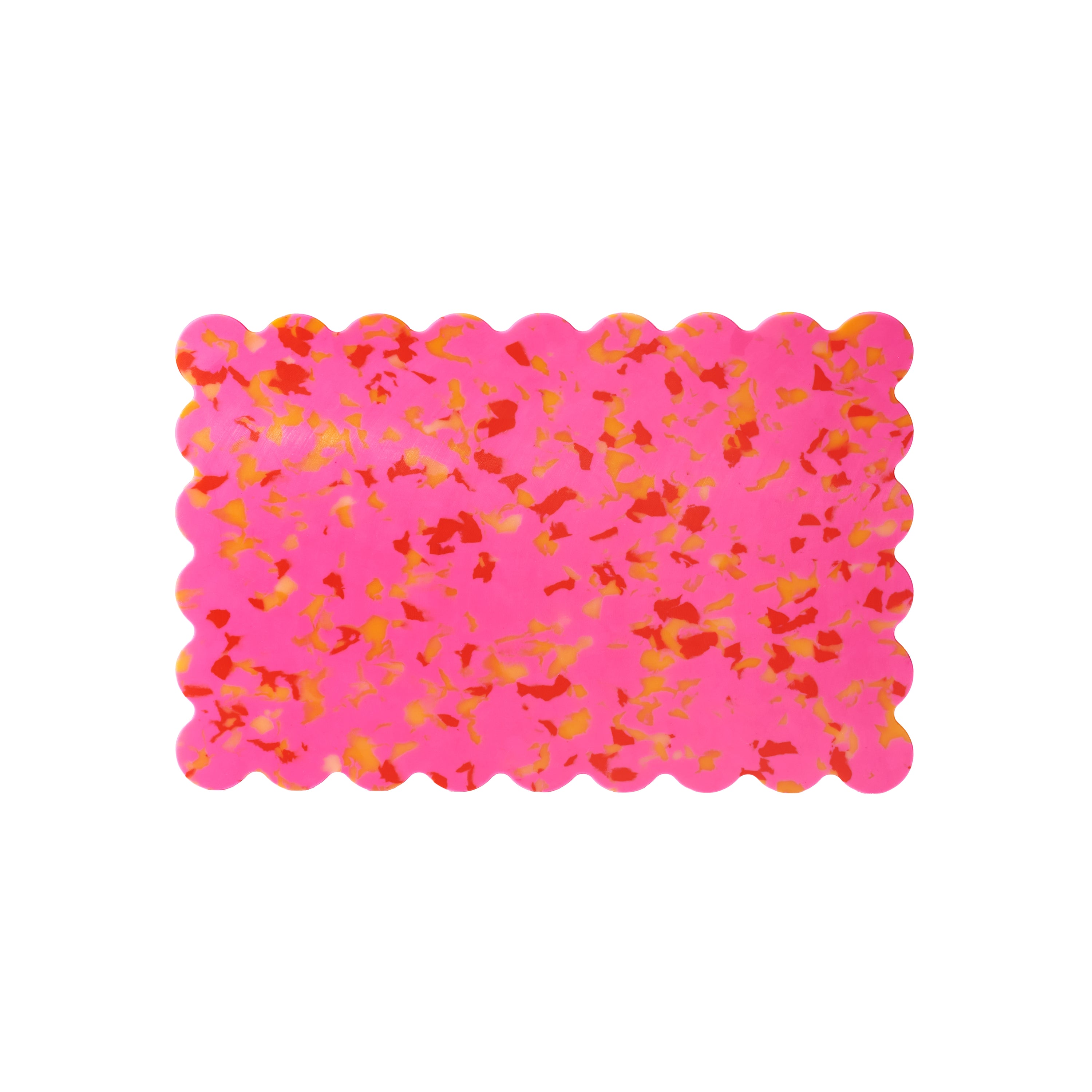 Pink scalloped cutting board with orange speckles, crafted from recycled BPA-free plastic