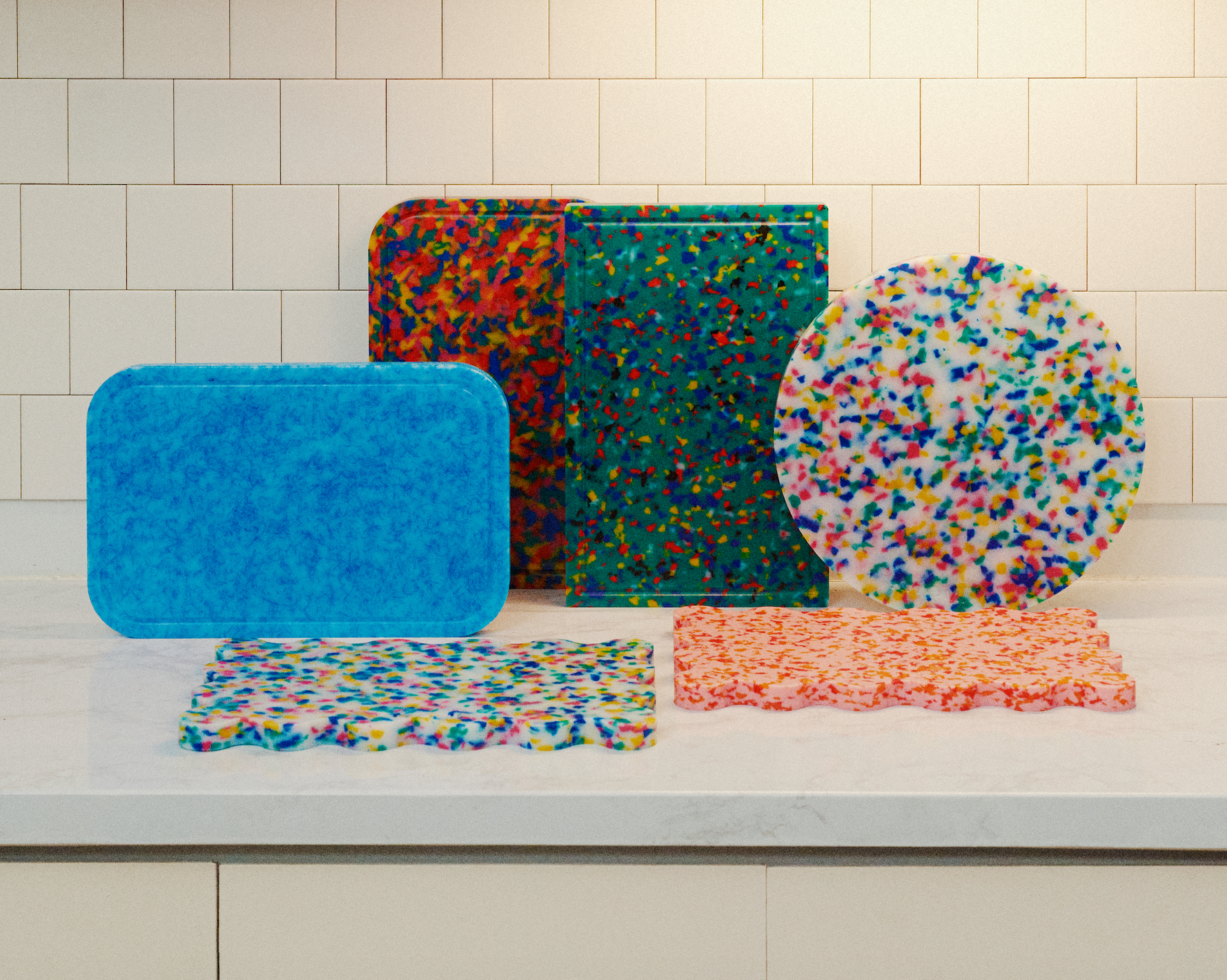 KIYOMI collection of colourful recycled plastic cutting boards displayed on a kitchen countertop
